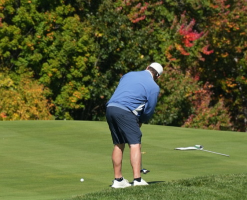 A golfer attempts a tricky putt