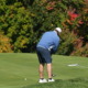A golfer attempts a tricky putt